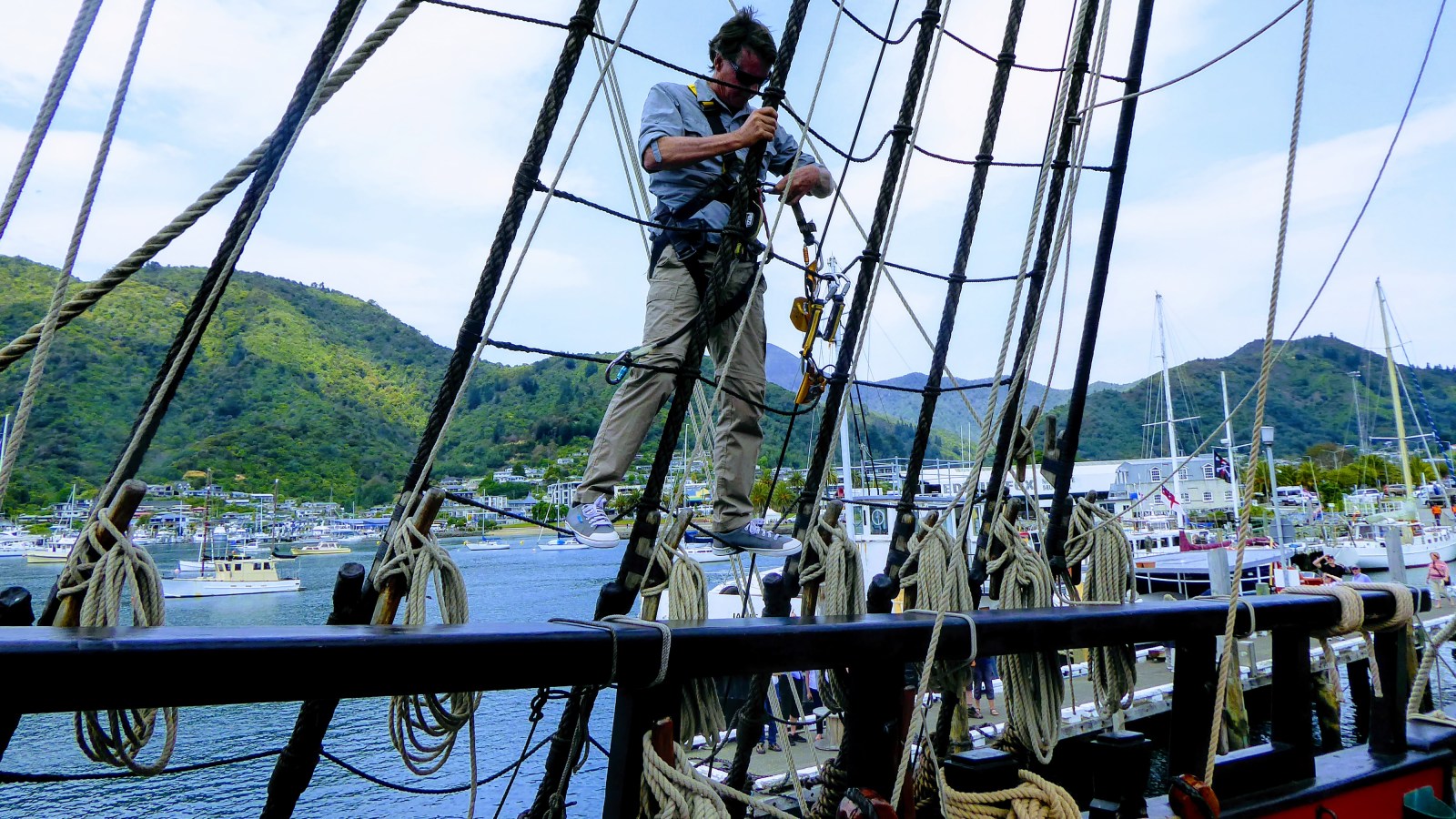 Climbing the rigging on HMB Endeavour while docked in Picton Harbour